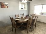 Dining area comfortably seats 6, kids table seats 4, and breakfast bar seats 2 more.